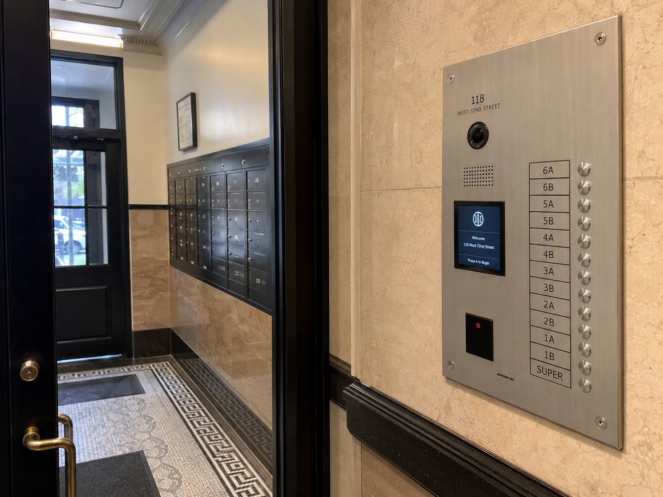 Video intercom panel installed beside a gated residential entry in New York City
